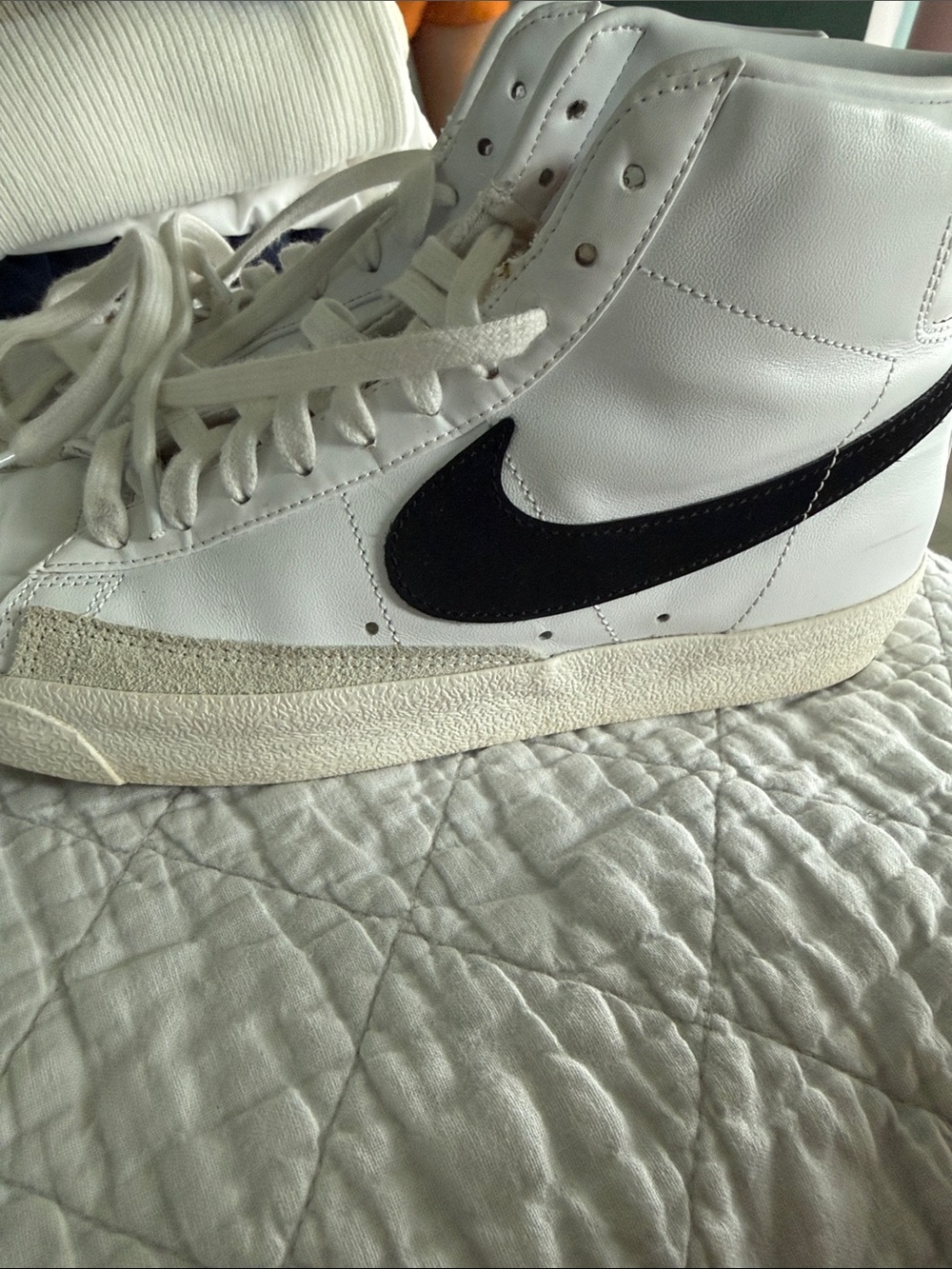 Nike White High-Top Sneakers with Black Swoosh